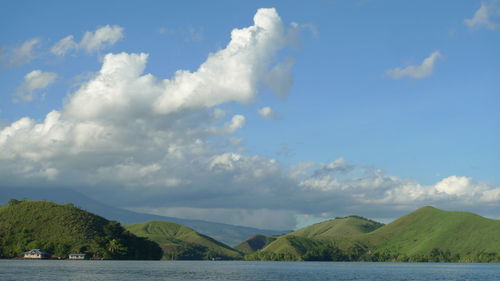 Scenic view of lake and mountains against sky