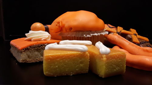 Close-up of ice cream cone against black background