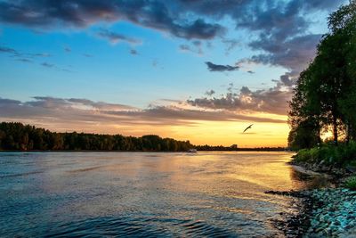 Scenic view of lake against sky during sunset