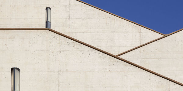 Low angle view of building against blue sky