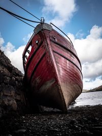 Low angle view of abandoned ship on beach