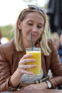 Close-up of a young woman drinking glass