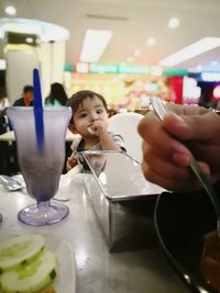 Portrait of boy holding ice cream at home