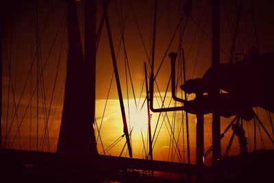 Silhouette ship against sky during sunset