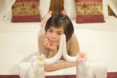 Portrait of smiling girl sitting at home