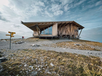 Built structure on a mountain against sky