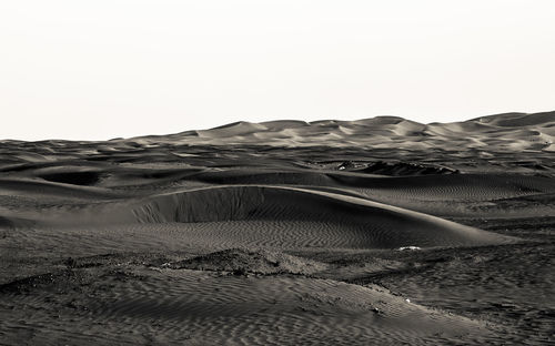 Scenic view of desert against clear sky