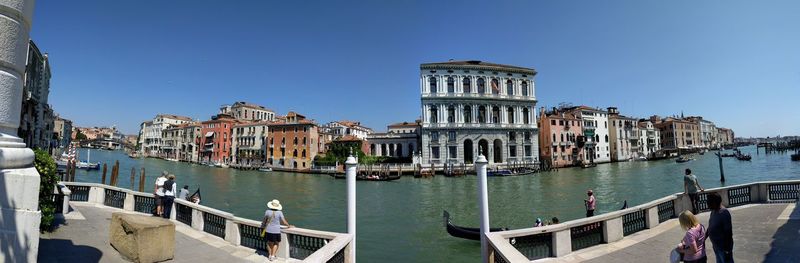 View of boats in canal along buildings