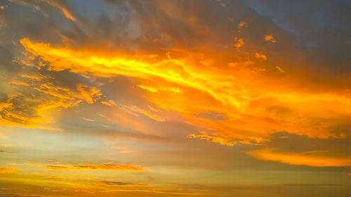 Low angle view of dramatic sky during sunset