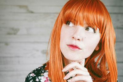 Redhead woman looking away