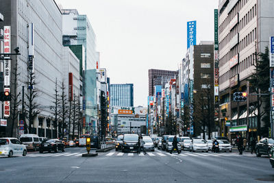 View of city street and buildings against sky