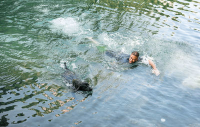 High angle view of man swimming in sea