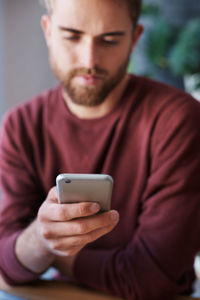 Close-up of woman using mobile phone