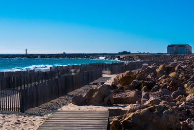 Scenic view of sea against clear blue sky