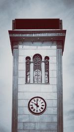 Low angle view of clock tower against sky