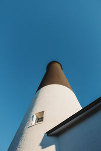 Low angle view of built structure against clear blue sky