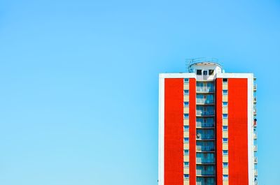 Low angle view of building against clear blue sky