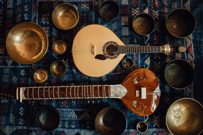 Traditional instruments: sitar and portuguese guitar and singing bowls