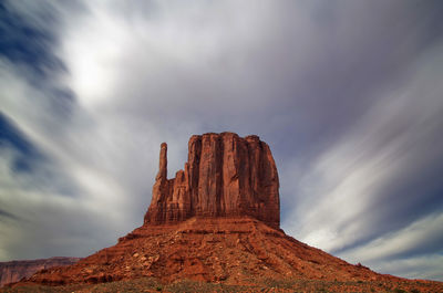 Low angle view of rock formation against sky