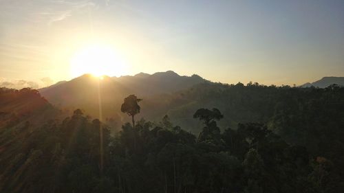 Scenic view of mountains against sky during sunset