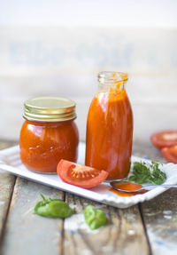 Close-up of sauce and tomatoes on table