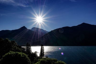 Sun shining over lake