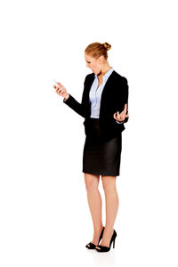 Full length of woman standing against white background
