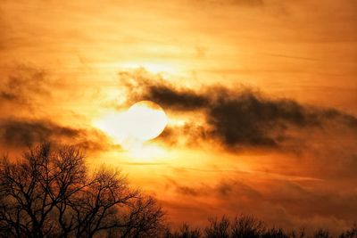 Low angle view of cloudy sky at sunset