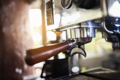 Close-up of coffee maker in cafe