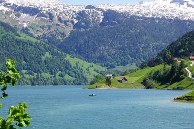 Scenic view of sea by mountains