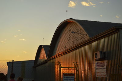 Building against sky during sunset