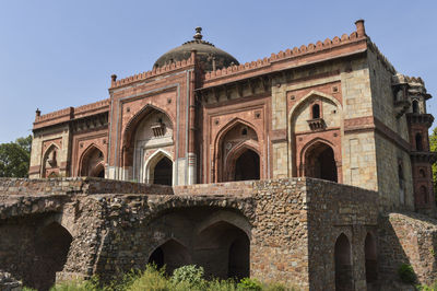 Low angle view of old building against clear sky