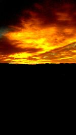 Scenic view of dramatic sky during sunset