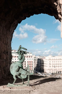 Statue of historic building against sky