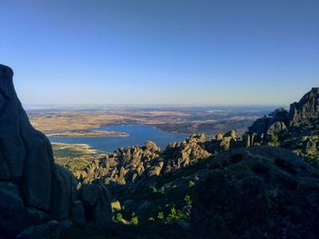 Scenic view of mountains against clear blue sky