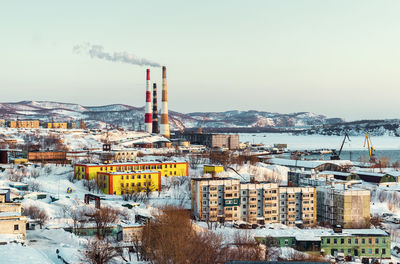 Chimneys in city during winter