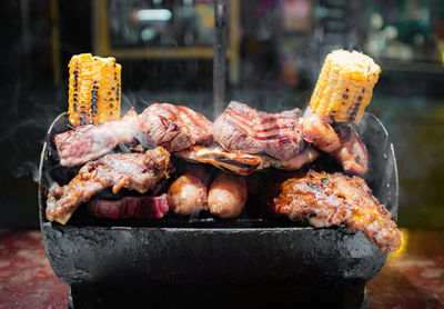 Close-up of meat on barbecue grill