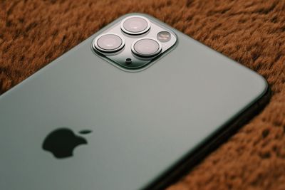 High angle view of smart phone on table
