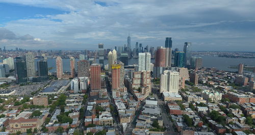 High angle view of modern buildings in city against sky