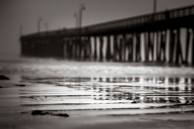 Bridge over sea against sky