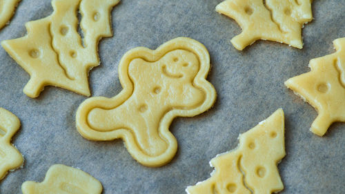 Raw christmas home made biscuits cookies. gingerbread man shaped cookie. 