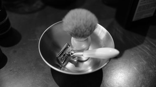 Close-up of razor and shaving brush