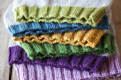 Close-up of multi colored knit hats on table