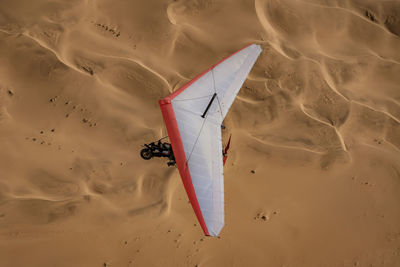 High angle view of paper on shore at beach