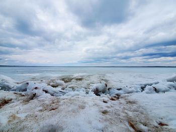 Scenic view of sea against sky during winter