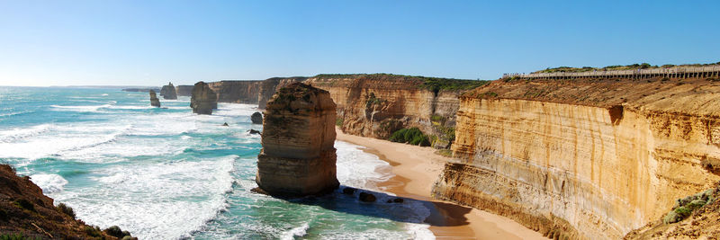 Scenic view of sea against clear blue sky