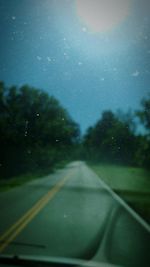 Road seen through car window