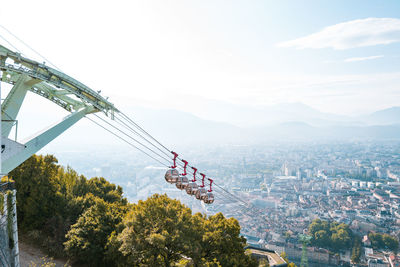 High angle view of overhead cable car against sky