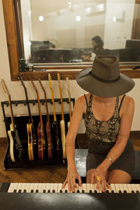 Young female musician playing a keyboard