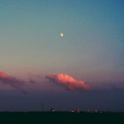Scenic view of landscape against sky at dusk